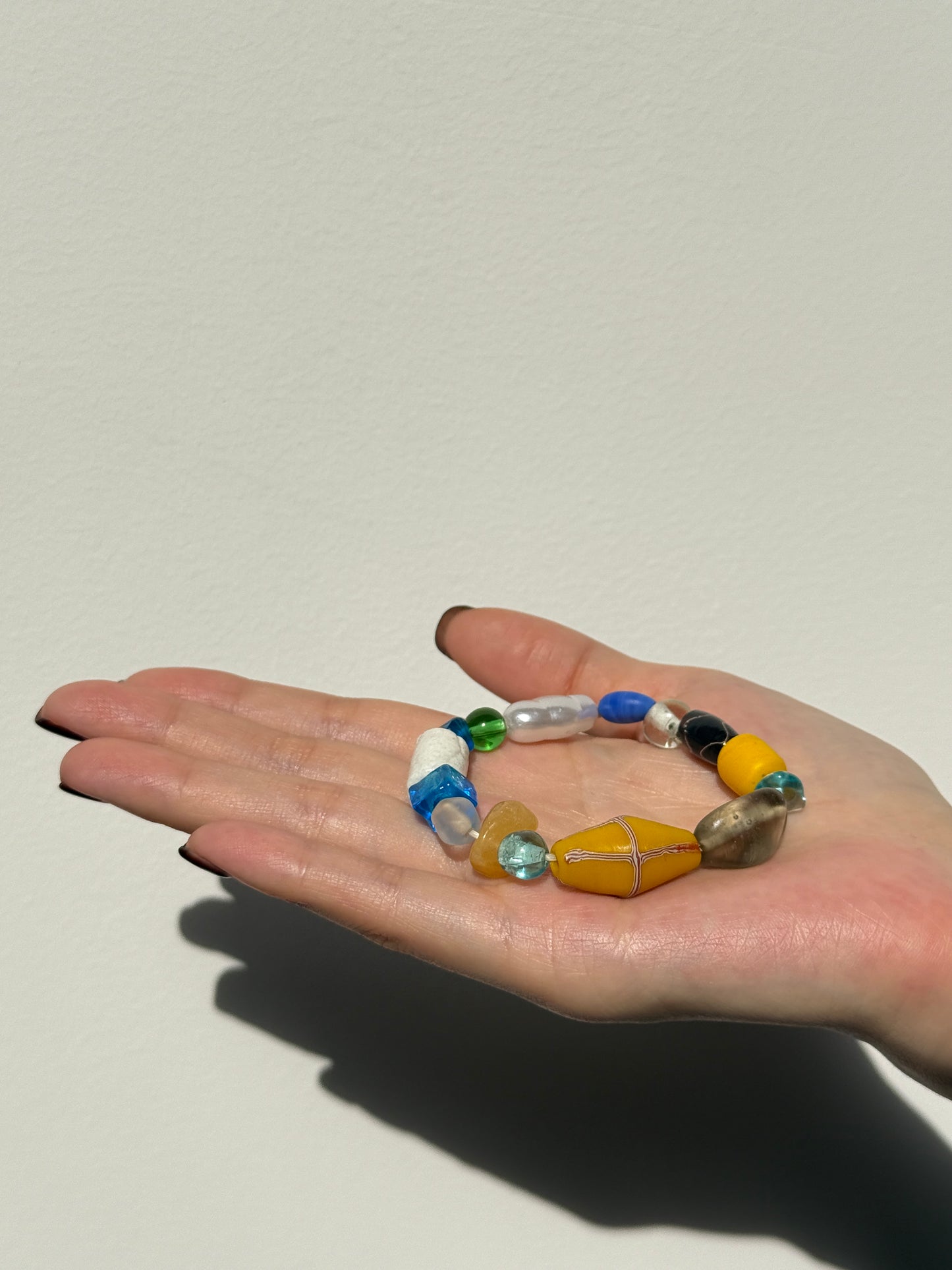 Wanderlight Series – Handmade Beaded Bracelet in Sunrise Yellow, Ocean Blue, Pure White & Forest Green