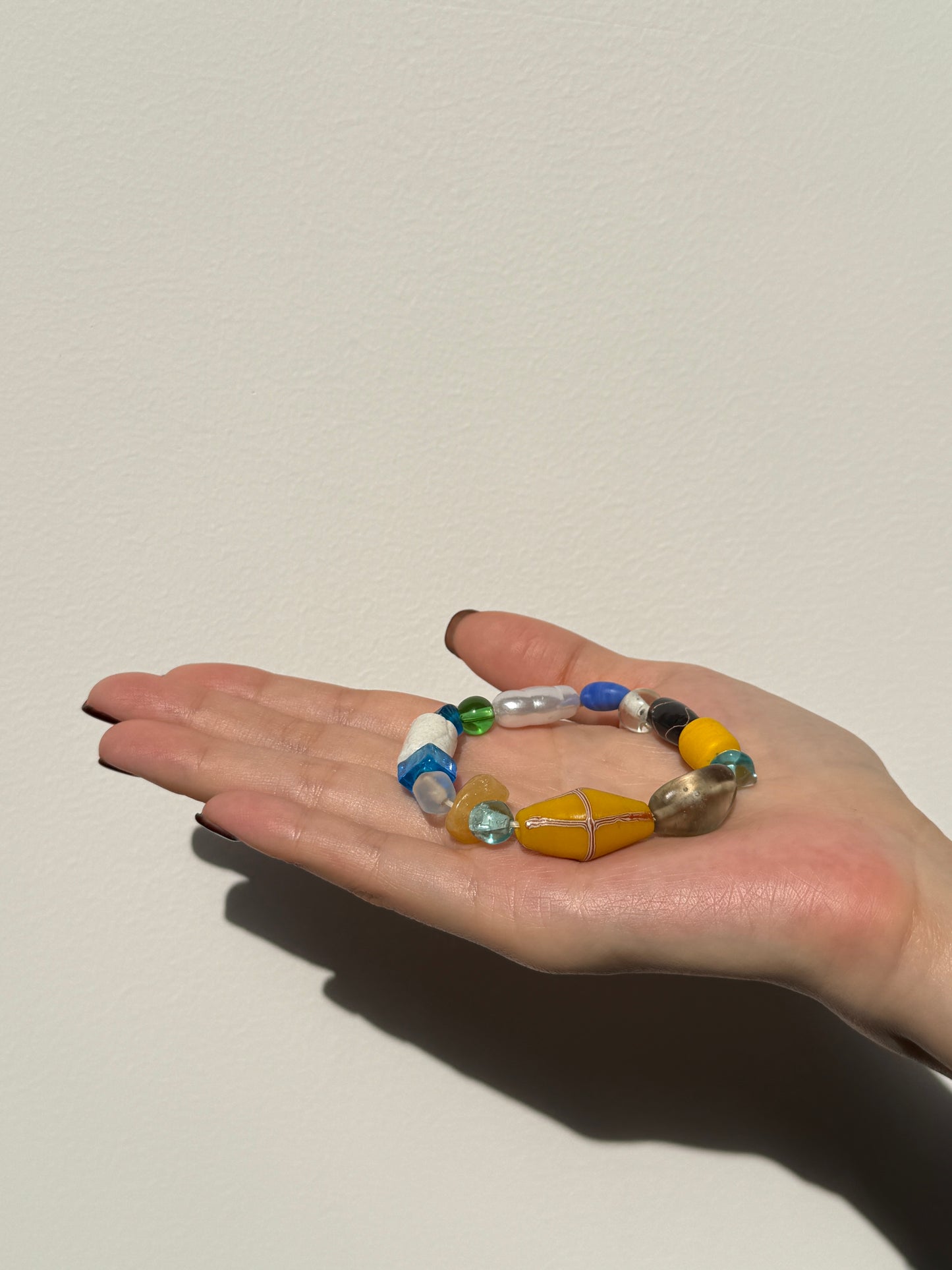 Wanderlight Series – Handmade Beaded Bracelet in Sunrise Yellow, Ocean Blue, Pure White & Forest Green